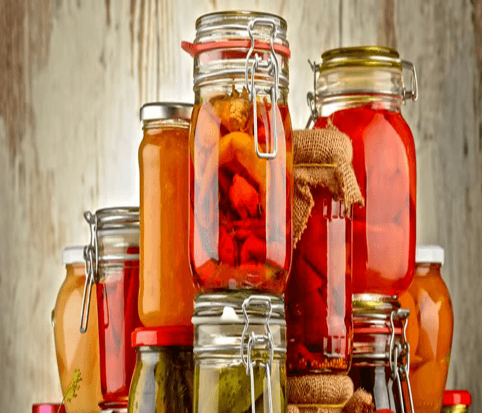 Jars of naturally preserved homemade food — Colonel's Pickle uses no artificial preservatives